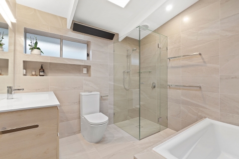 Cheltenham-Main bathroom. We extended the room to incorporate a toilet into the space. Sleek wall mounted strip heater to warm up the winter mornings